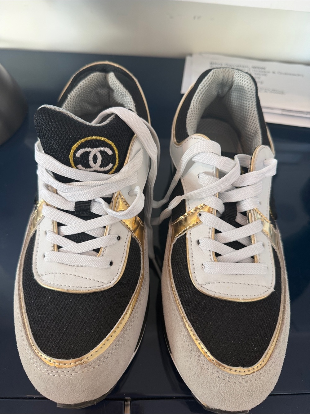 CHANEL Black White and Gold Low-Top Sneakers